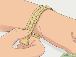 Locate the small metal pin that secures the left watch clasp; 5 Simple Ways To Adjust A Metal Watch Band Wikihow