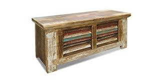 Wooden trunk coffee tables are a classic choice and can look very different depending on the wood species and finish you go for. Crafters And Weavers Rustic Distressed Reclaimed Solid Wood Painted Trunk Coffee Table Buy Online In Serbia At Serbia Desertcart Com Productid 8411550
