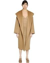This iconic silhouette is crafted of luxurious camel hair and is flatteringly wrapped at the waist giving a feminine feel to the timeless outerwear piece. Max Mara Hooded Belted Camel Coat 2 990 Luisaviaroma Lookastic