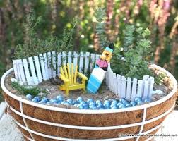 The figurines and accents add to the beauty of the real plants and flowers you include in your. Miniature Fairy Gardens With A Beach Theme In Pots And Baskets Coastal Decor Ideas Interior Design Diy Shopping