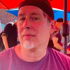 Does anyone know which elementary school Andy Reid attended? Also at what  hospital did his mother work at?