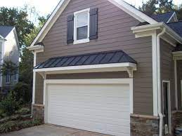 It should be on and steady. Replaced Rotten Masonite With Harplank Har Board Carries A 30 Garage Exterior Garage Door Design Garage Door Styles