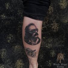 African american black angel tattoo. Black Angel Tattoo Piercing Photos Facebook