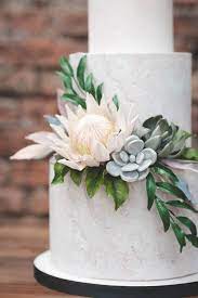 Botanical Floral Contemporary Peach And White Wedding Cake With Sugar Flowers Protea And S Succulent Wedding Cakes Boho Chic Wedding Cake Floral Wedding Cakes