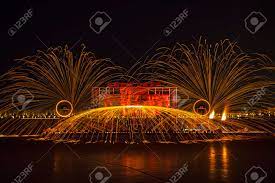 Chinese Craftsmen Spin Hot Iron Melt At High Speed, Performing In The  Darkness, Which Is A Traditional Cultural Heritage Stock Photo, Picture and  Royalty Free Image. Image 177803200.