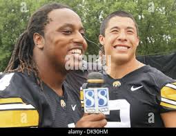 Iowa defensive back Greg Castillo (2) runs in a NCAA college football game  against Northern Illinois in Chicago, Illinois