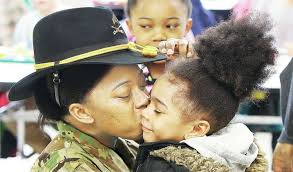 Returning soldier surprises daughters at Alton's West Elementary School