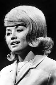 She has been wearing them her entire professional career, which spans way back into the '60s. Dolly Parton S Best Hair Moments From Beehives To Bodacious Bobs Vogue