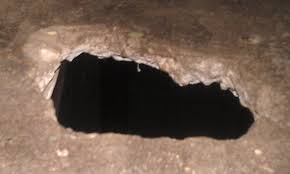It seems as though it was caused by water. How To Fix A Through Hole In A Concrete Step Home Improvement Stack Exchange