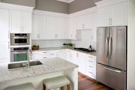 First, the oak cabinets have a light stain and the countertops are white granite. Most Popular Kitchen Cabinet Colors In 2019 Plain Fancy Cabinetry