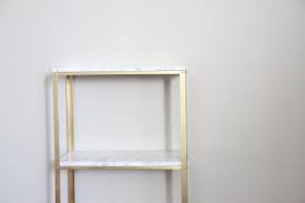 The Easiest Diy Hack To Glam Your 14 99 Ikea Hyllis Shelf Unit Into Marble And Gold Shelves Ikea Diy Home Decor Projects Easy Diy Hacks
