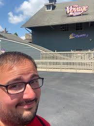 Amateur carpenter admires wooden roller coaster construction