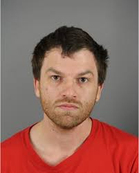 Wisconsin QAnon believer charged with shooting at Army base