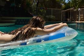 ✓ free for commercial use ✓ high quality images. Teenager Relaxing On Floating Mattress In Pool By Tana Teel Air Mattress Sunbathe