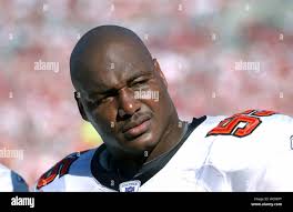 Tampa Bay Buccaneers linebacker Derrick Brooks is chased by Washington  Redskins wide receiver Darnerien McCants and tackle Jon Jansen as he  returns an interception 44 yards for a touchdown Sunday, Oct. 12,