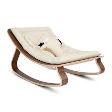 Glider rocking chairs push the backrest farther and glide the seat more being better for deep relaxation of the muscles, spine and neck. Charlie Crane Levo Baby Rocker In Walnut And Organic Off White Seat