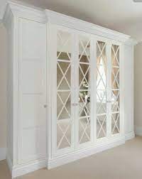 Classic Mirrored Doors With Criss Cross Frames Make The Wardrobes Stand Out Ikea Closet Design Master Bedroom Closet Mirror Closet Doors