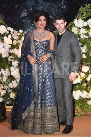 Photos Priyanka Chopra And Nick Jonas Look Regal At Their Reception Priyanka Chopra Wedding Indian Celebrities Indian Dresses