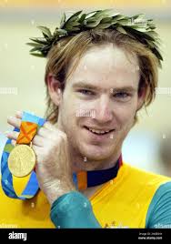 Australia's Ryan Bayley shows his gold medal after the men's sprint finals  at the 2004 Olympic Games velodrome in Athens Tuesday, Aug. 24, 2004. (AP  Photo/Alastair Grant Stock Photo
