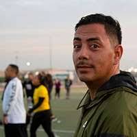 Royal Saudi Naval Forces (RSNF) Capt. Sultan A-Al-Zarer and Lt.Cmdr Keith  Applegate talk at the conclusion of an honors ceremony .