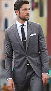 A grey suit is easy to mix and match, a darker waistcoat, or even a different colour. Grey Suit Ideas Dress Yy