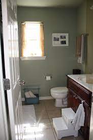 The sage green wall tone comes from the mountain sage wall siding by james hardie. Sage Green Walls White Fixtures Light Tan Floor Bathroom Wall Colors Sage Green Walls Tan Bathroom