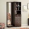 It opens to reveal a large mirror and a set of drawers and box shelves for storing makeup and hygiene products. 1
