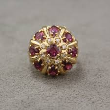 A beautiful vintage 14kt white gold ring that features 10 round faceted cut medium purplish red rubies, est. Vintage 14 Karat Yellow Gold Ruby And Diamond Cluster Ring