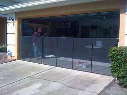 Handmade in the usa · great customer service · pet door experts Black Pool Fence Installed Across Garage Door Garage Doors Pool Fence Garage Door Makeover