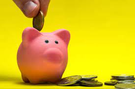 This tiny island in the middle of the irish sea has established itself as a stable and transparent financial center. Pink Piggy Bank On A Yellow Background Around A Coin A Mans Stock Photo Picture And Royalty Free Image Image 148385781