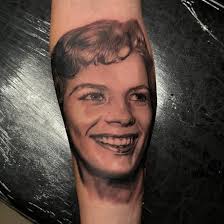 Tattoo artist completes meaningful black and gray piece