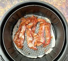 You may need to tear or bend the pieces of bacon to get them to fit, depending on the size of the basket. Easy Air Fryer Bacon Cooking Video
