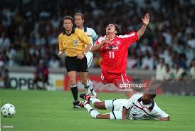 Usa 1 in the 1998 world cup information about the 1st round group f game played in the 1998 soccer world cup between the national teams of usa and iran with details about goals, starters and reserves, substitutions, cards and more. World Cup Finals Lyon France 21st June 1998 Usa 1 V Iran 2 Iran S Khodadad Azizi Is Tackled By Usa S David Regis