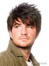 Pompadour cut with teal and blonde highlights