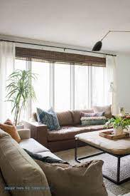 Couches In Front Of Windows Leather Couch In Front Of Windows In Midcentury Vintage Modern Living Room Furniture Design Living Room Bedroom Furniture Design
