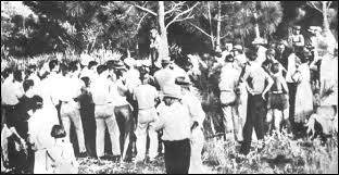 The photos of the strange fruit hanging from the massive indiana tree bore the illegitimacy of a twisted nation reveling in. Lynching