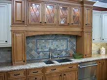 In this kitchen renovation we installed design craft frameless cabinetry in the mendocino door style with two decorative designer gold framed cabinets in the gable door style in maple with amaretto stain with a custom panel for the refrigerator and dishwasher. Kitchen Cabinet Wikipedia