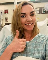 🎉🏥 Surgery Debut Alert! 🏥🎉 Swipe left to see me rocking the ultra-chic  hospital gown and giving my best “I'm slightly nervous but also ready for  my post-op ice cream” smile. 😅🍦