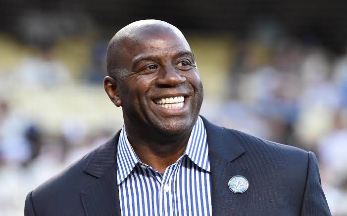 AP source: Magic Johnson joins Harris' bid for Commanders