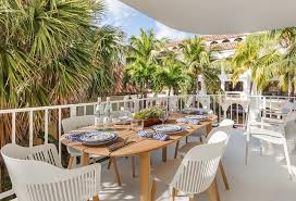 Explore modern outdoor dining furniture that helps you feast in style. Oval Teak Plank Top Outdoor Dining Table With White Chairs Transitional Deck Patio