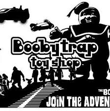 Something dangerous, especially a bomb, that is hidden inside somewhere that looks safe: Booby Trap Toy Shop Home Facebook