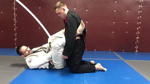 Jason Dignan a black belt in both BJJ and Judo shows a driving version of  osoto gari