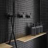 This elegant bathroom features black and white marble. 3
