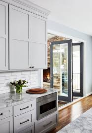 Grey kitchen cabinets are always the top choice among the countless available cabinets. Transitional Light Grey Kitchen With Dark Grey Island Crystal Cabinets