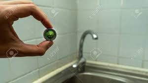 Grip the aerator with your hand and unthread it clockwise (when viewed downward from above) to remove it from the end of the faucet spout. Cleaning The Water Tap The Male Hand Holds A Clogged Aerator Sediment In Water Stock Photo Picture And Royalty Free Image Image 149917662