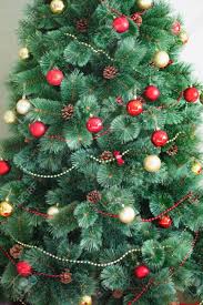 Choose ornament sets with one or two colors to create a uniform and polished look. Artificial Christmas Tree Decorated In Traditional Red And Gold Stock Photo Picture And Royalty Free Image Image 128231883