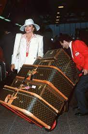 Joan Collins Does Glamour How To Dress Like A Style Icon Louis Vuitton Luggage Louis Vuitton Trunk Stylish Luggage