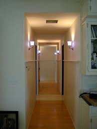 Make your foyer more welcoming by adding wall sconces on either side of an entryway mirror. Sconces Hallway Lighting