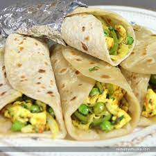 Kathi Roll Prepared By Stuffing The Tortilla With Spicy And Healthy Filling Of Paneer Makes These Rolls Hit Kathi Roll Recipe Frankie Recipe Paneer Kathi Roll