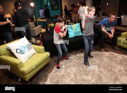 Mason Cook, left, his brother Lane Cook, center, and Devon Sawa are seen at  the G3 Miracle Lounge presented by Xbox 360